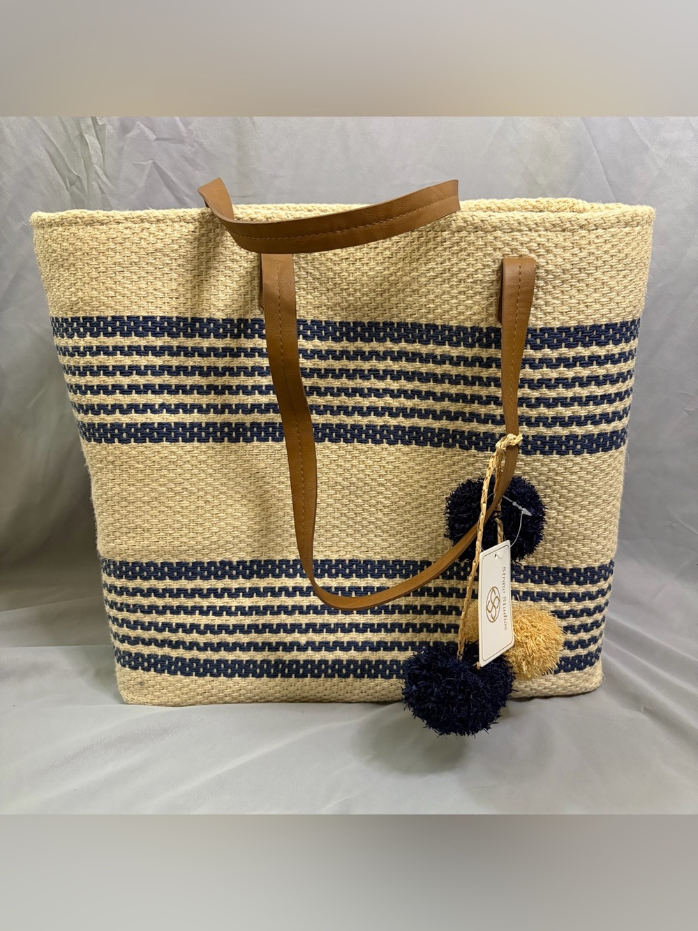 Straw Studios Navy & Tan Striped Woven Tote with Pom Pom Charm